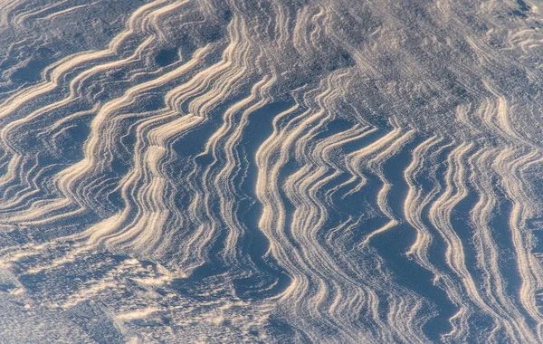 A hó dune minták egy napsütéses napon a hátország textúra — Stock Fotó