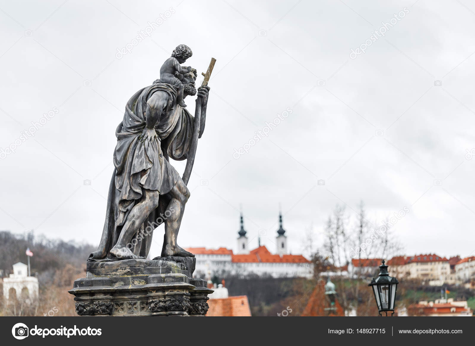 Statue Of Child Christus At The Shoulder Of Saint Christopher Patron Of Wanderers Navigators And Travelers On Charles Bridge Prague Stock Photo By C Frantic00 148927715