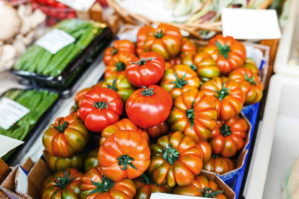 Unusual tomato sort Reise tomato sliced on the farm eco market