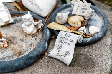 24 MARCH 2017, VIENNA, AUSTRIA: Udo Jurgens grave in Vienna central cemetery Friedhof decorated with piano and flowers