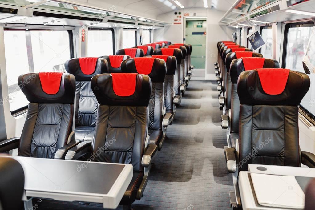 Empty leather seats await passengers in the luxury and modern train