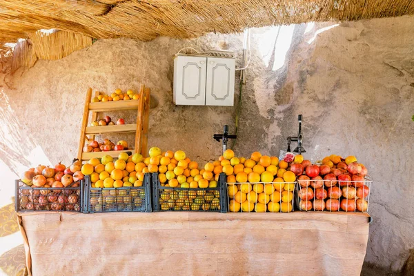 Juice fruit bar with oranges and pomegranates at the counter of a rustic cafe in Cappadocia