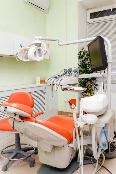 Dental clinic interior with working chair and medical tools