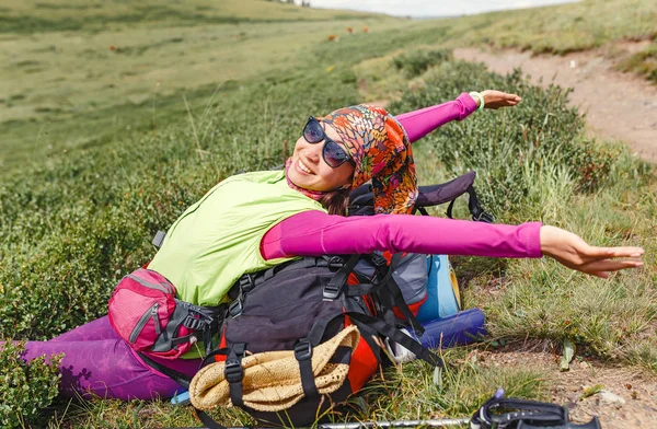 happy hiker woman relax and lying in nature