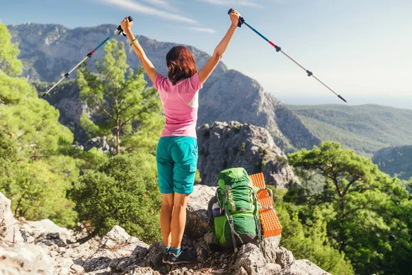 Hiker young woman with backpack walking on a Lycian trail in valley among summer mountains — Stock Photo, Image