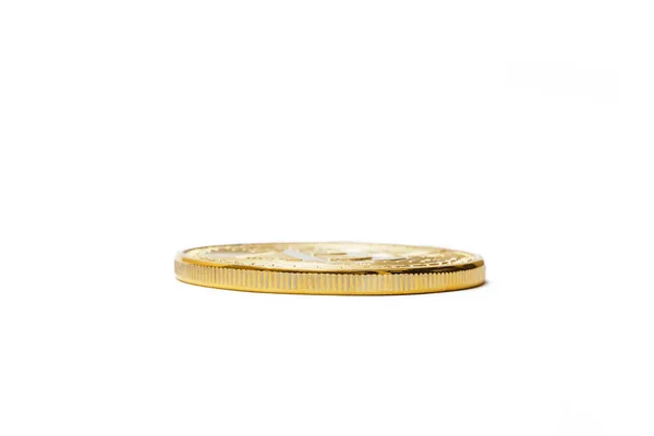 Altın bit sikke kaburga üzerinde beyaz izole — Stok fotoğraf