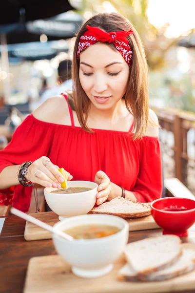 Asian woman eating hot vegetarian soup in cafe. Healthy diet and dinner concept — Stock Photo, Image