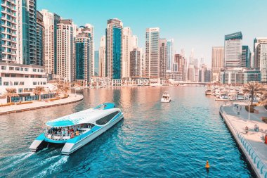 29 November 2019, Dubai, United Arab Emirates: Tourist cruise ferry boat sailing in Dubai Marina harbor