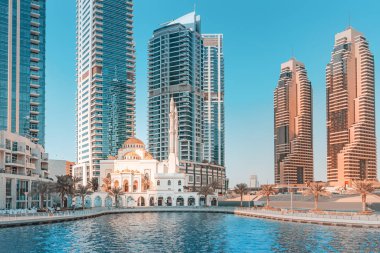 Dubai marina skyscrapers and famous muslim mosque