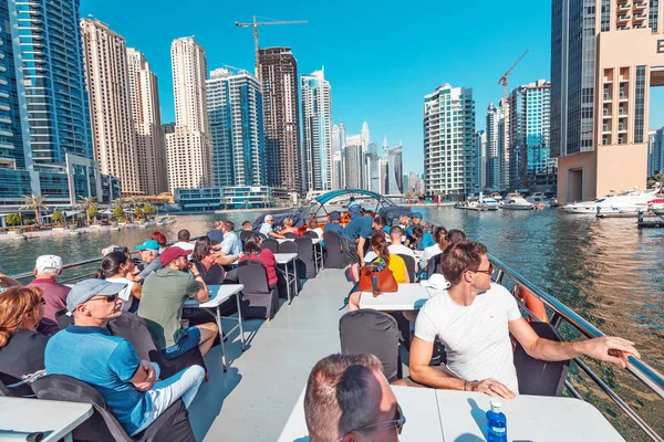 29 November 2019, Dubai, United Arab Emirates: Passengers on a deck of big ferry boat in Marina port — Stock Photo, Image