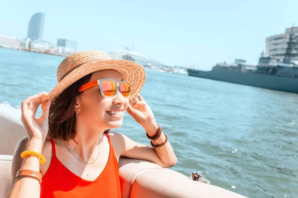 Asian woman on a sailing cruise in sea resort. Travel and tour concept