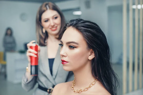 Girl Hairdresser Stylist Puts Hair Spray Young Client Beauty Salon — Stock Photo, Image