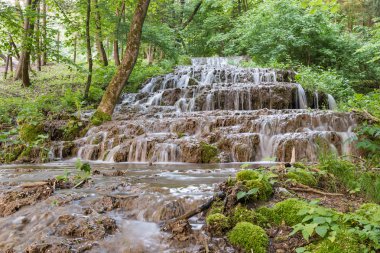 Clear waters of the creek, waterfalls. clipart