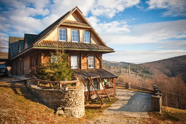 Mountain cottage among forests   in autumn. Landscape in the Silesian Beskids Mountains, Poland