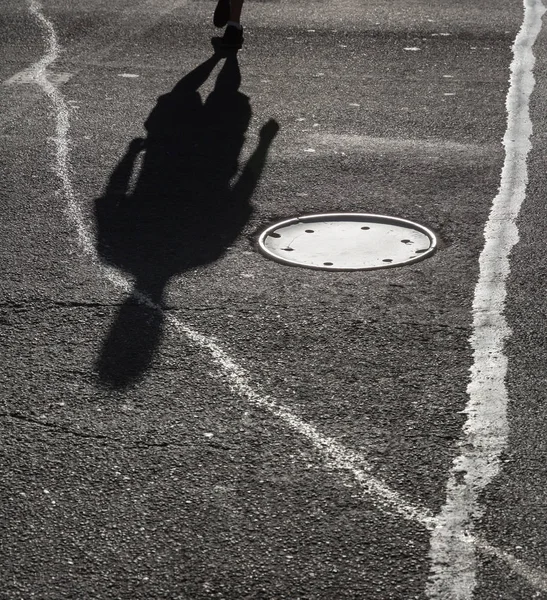 Shadows of people walking street — Stock Photo, Image