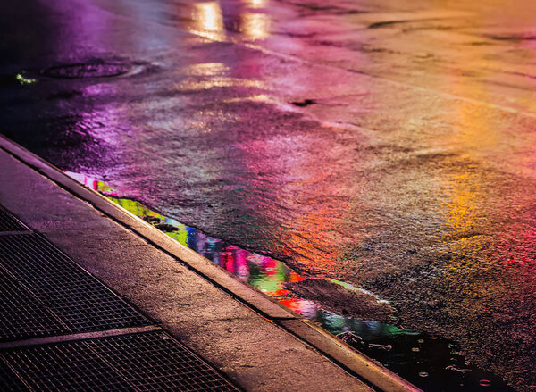 NYC streets after rain with reflections on wet asphalt Stock Photo