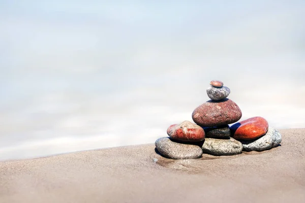 The heap of stones on a sandy beach — Stock Photo, Image
