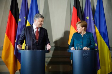 Petro Poroshenko ve Angela Merkel