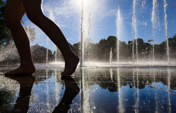 children playing in fountain