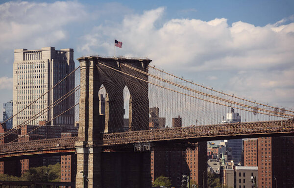 NEW YORK, USA - Apr 27, 2016: Brooklyn Bridge in New York City. It connects Manhattan and Brooklyn over the East River. View from Brooklyn Promenade