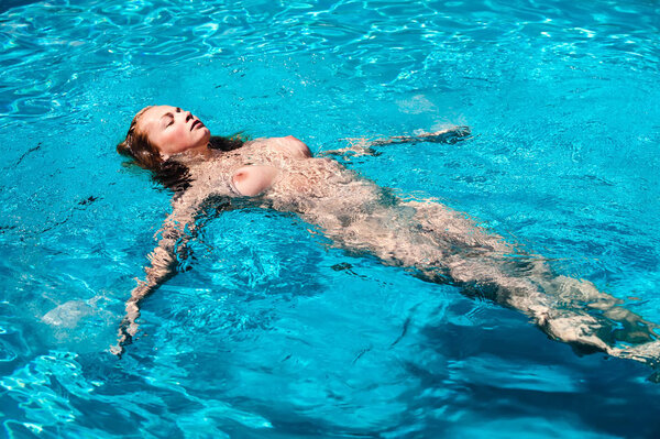 naked woman in swimming pool