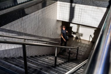 Man comes out of NYC subway station clipart