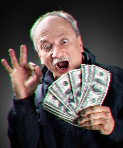 Happy elderly with fan of money — Stock Photo, Image