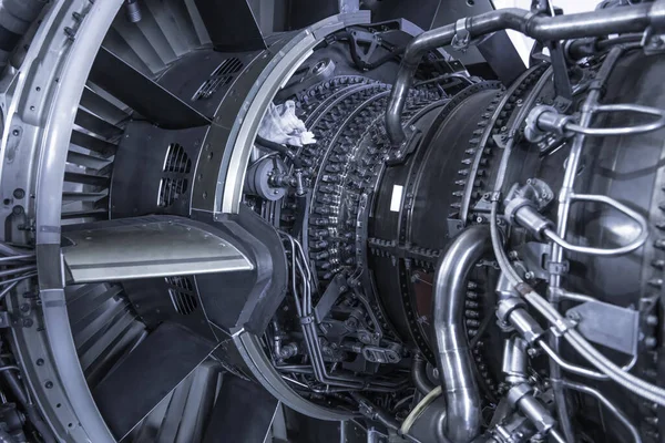 Turbine Engine. Aviation Technologies. Aircraft jet engine detail during maintenance. Blue toned.