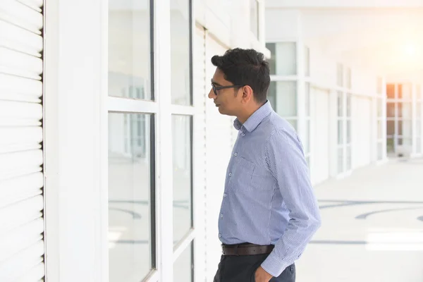 Male real estate looking in window — Stock Photo, Image