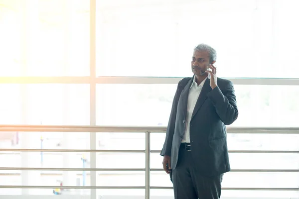 Senior indian business male with phone — Stock Photo, Image