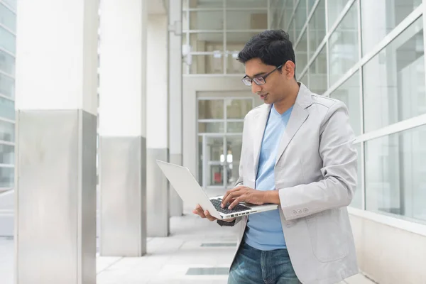 Indian male with laptop — Stock Photo, Image