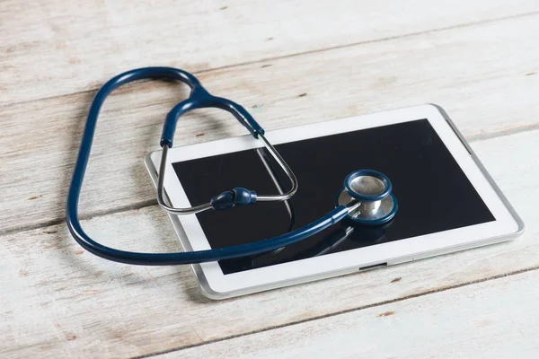 stock image desk with digital tablet and stethoscope 