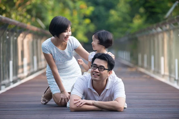 Asian family on a bridge — Stock Photo, Image