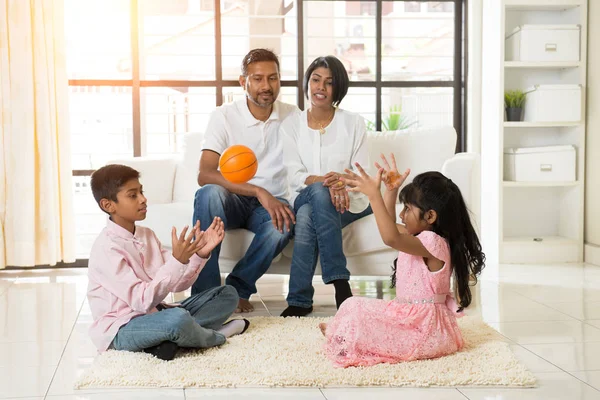 Indian family playing with ball — Stock Photo, Image