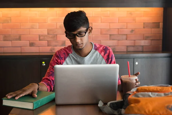 Indian teenage male  doing homework — Stock Photo, Image