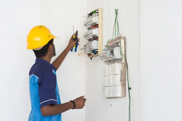 electrician working with switchboard