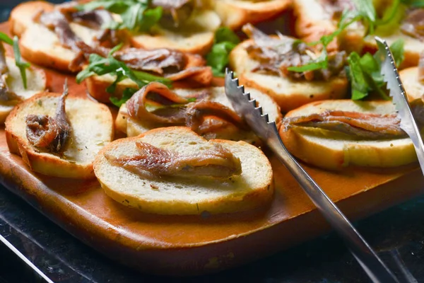 Classic Italian appetizer anchovies bruschettas — Stock Photo, Image