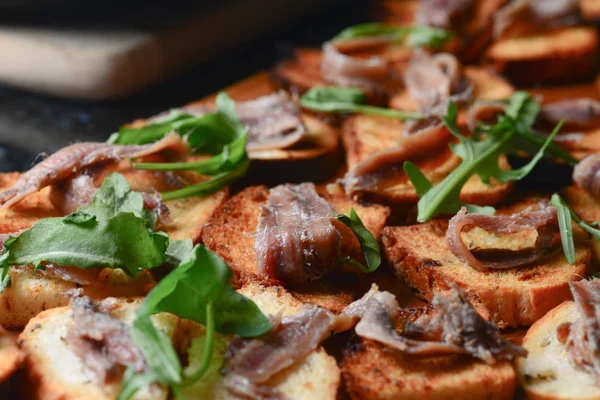 Classic Italian appetizer anchovies bruschettas — Stock Photo, Image