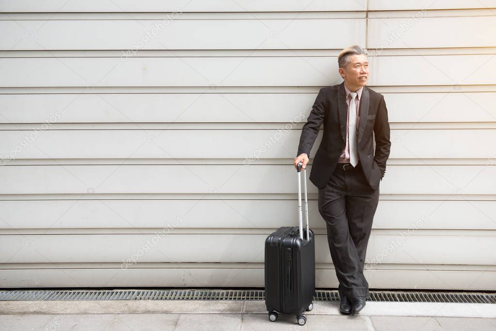  businessman traveling with suitcase
