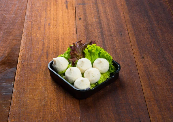 Raw fishballs and lettuce — Stock Photo, Image