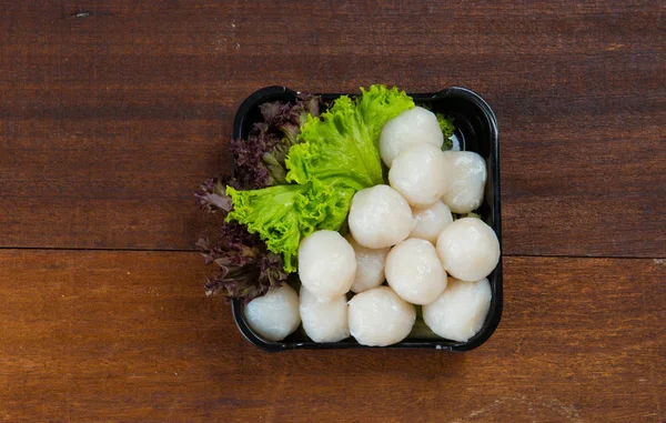 Raw fishballs and lettuce — Stock Photo, Image