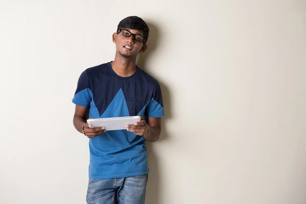 Indian young man with tablet computer — Stock Photo, Image