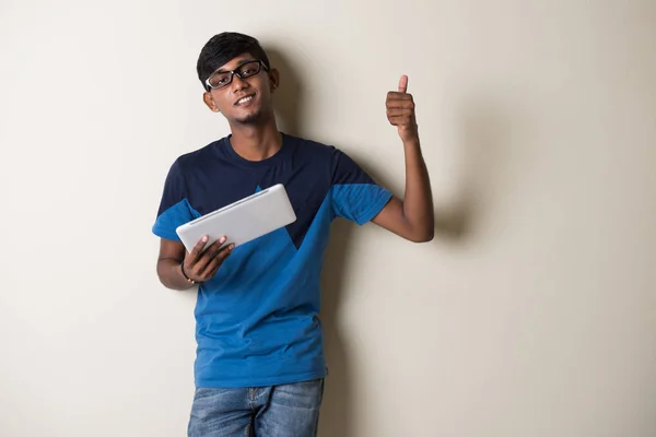 Indian young man with tablet computer — Stock Photo, Image