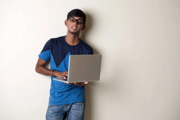 Indian young man with laptop — Stock Photo, Image