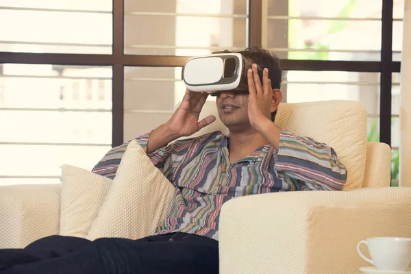 Indian man in vr glasses