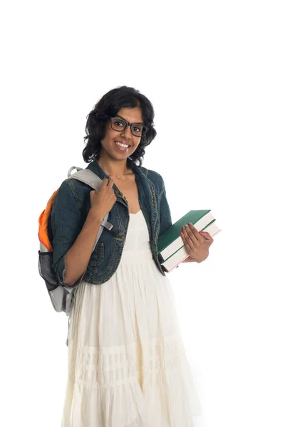 Kvinnlig student med böcker och ryggsäck — Stockfoto