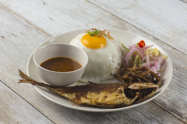 fried fish with rice with spices and curry