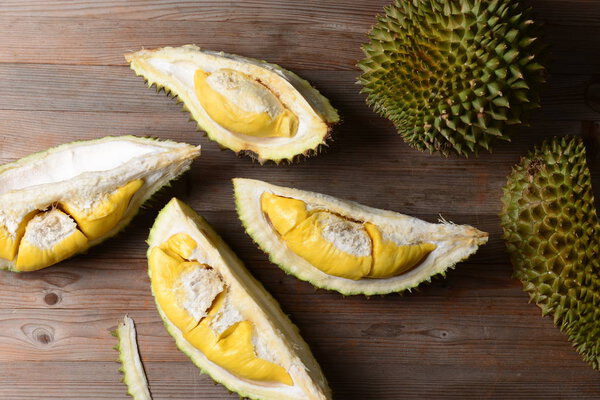 Durian riped and fresh, durian peel with yellow color on wooden table