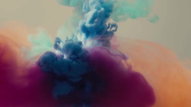 Four colors of ink dropped in water — Stock Video