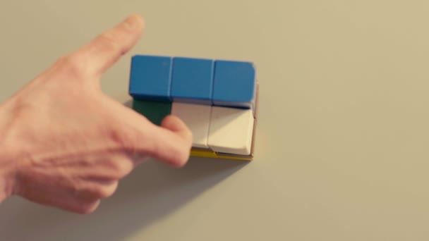 Mans hand playing 3D tetris — Stock Video